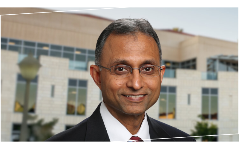 Interim dean Naren Agrawal in front of Lucas Hall
