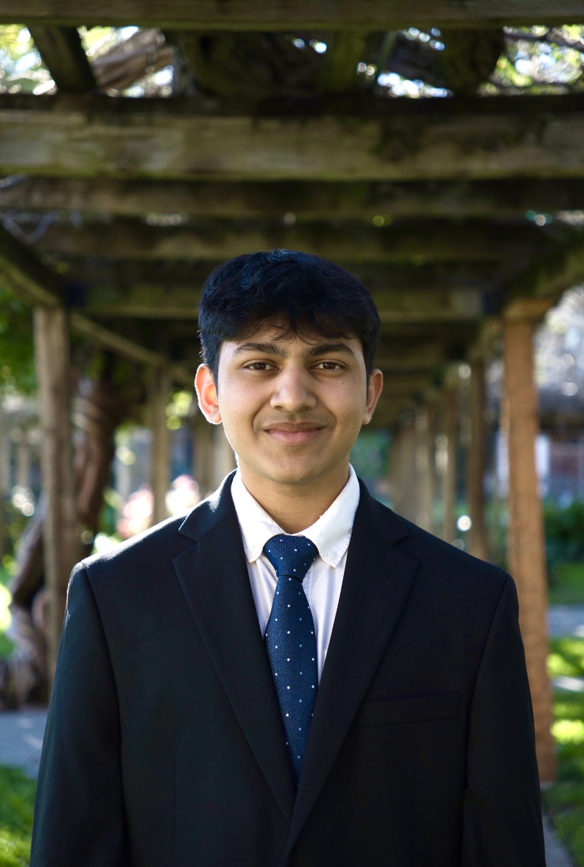 Male Student dressed in a suit and tiel