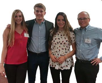 Four people posing for 