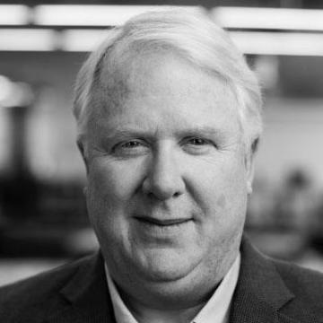 Black-and-white portrait of a man in a suit.