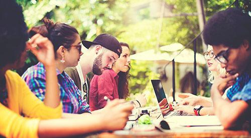 Students working together outside 