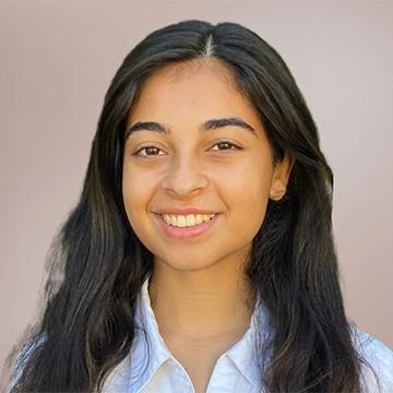 Woman smiling in blue shirt