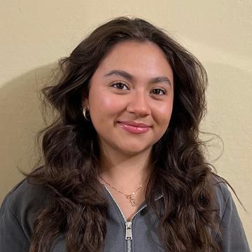 Woman with brown hair smiling