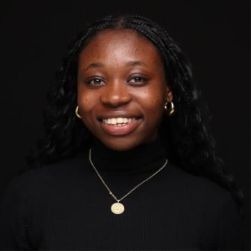 Woman in black top smiling