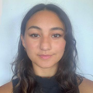 Woman smiling in black sleeveless shirt
