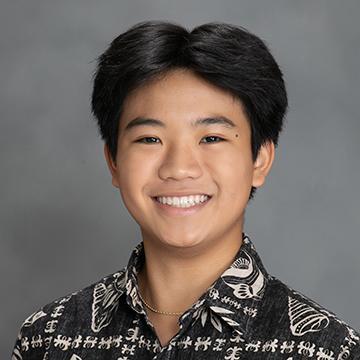 Man in hawaiian shirt smiling