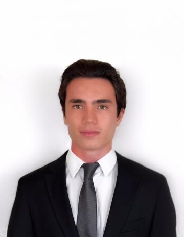 A person in a suit and tie against a white background.