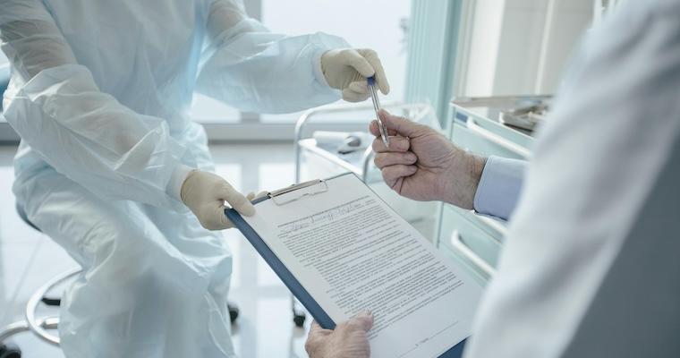 Doctor handing a Document 