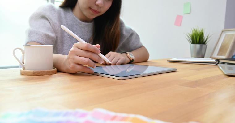 Young creative woman using stylus and tablet image link to article