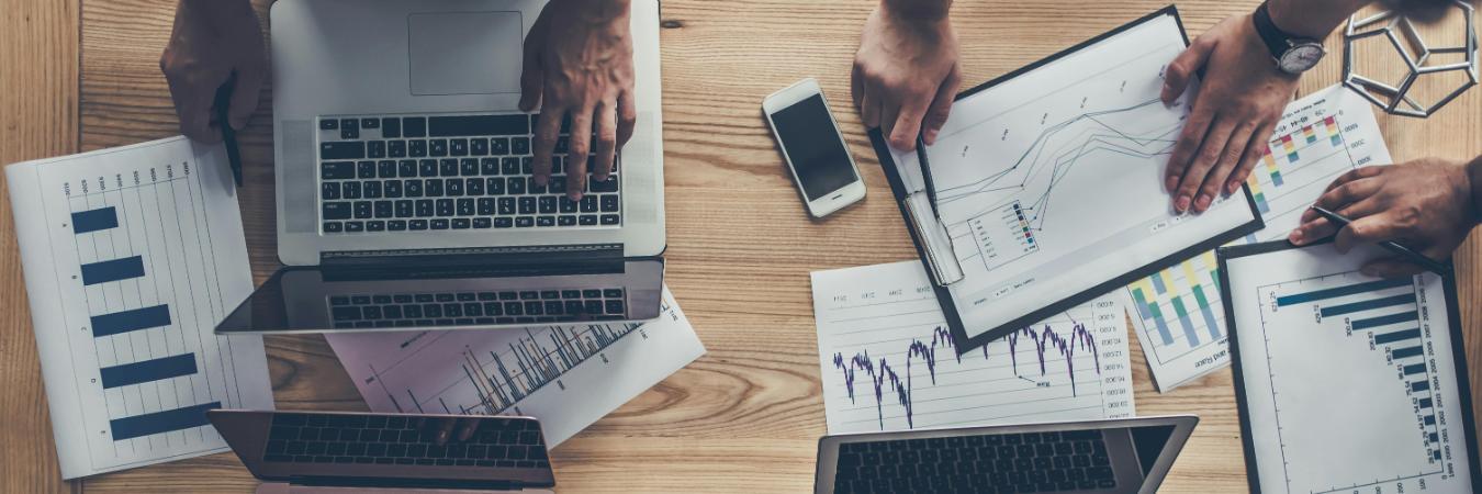 Professionals collaborating in a modern office, working with data.