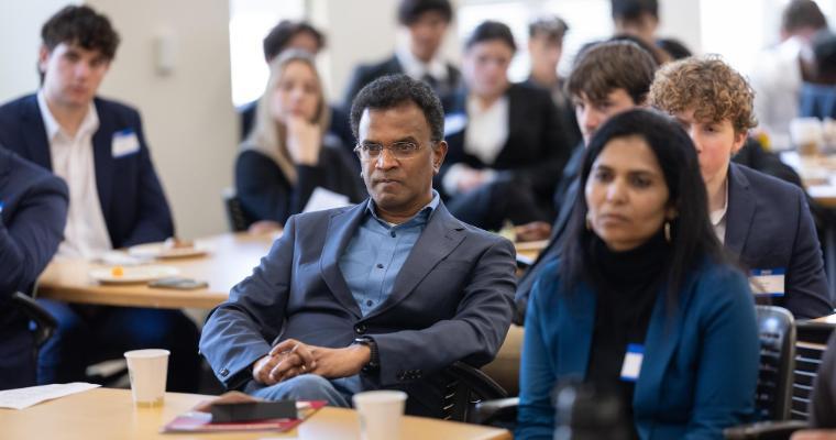 Panel judges listening intently to Leavey student international business case presentations image link to article