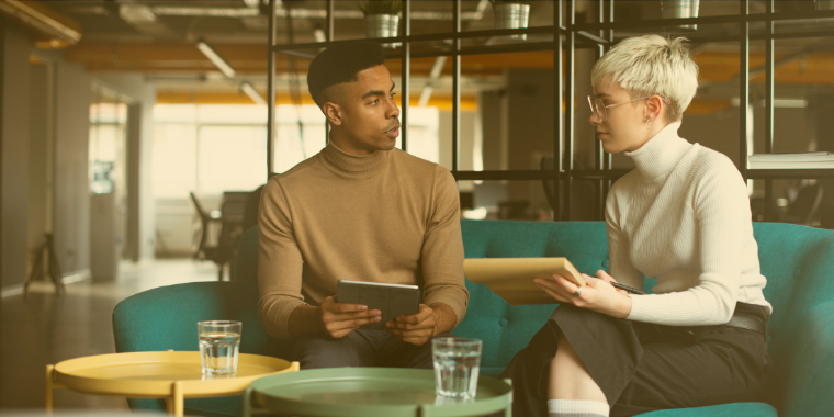 Photo of two people having a meeting image link to story