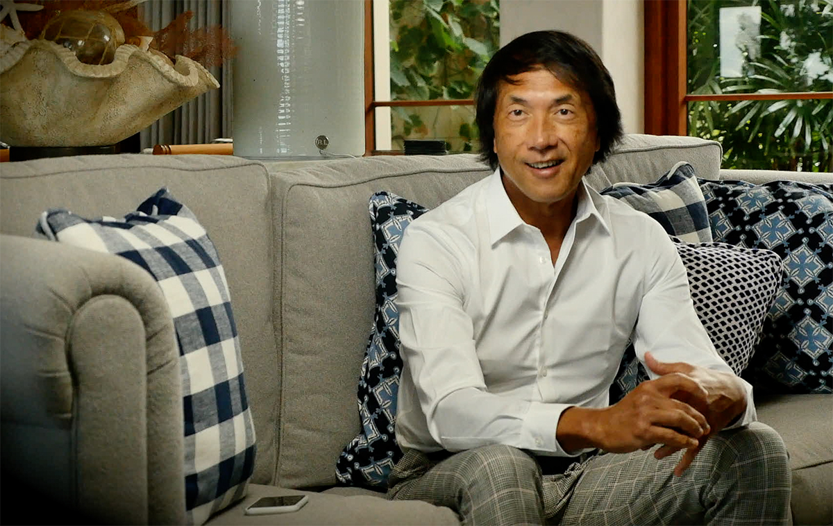 John Ocampo sitting on couch