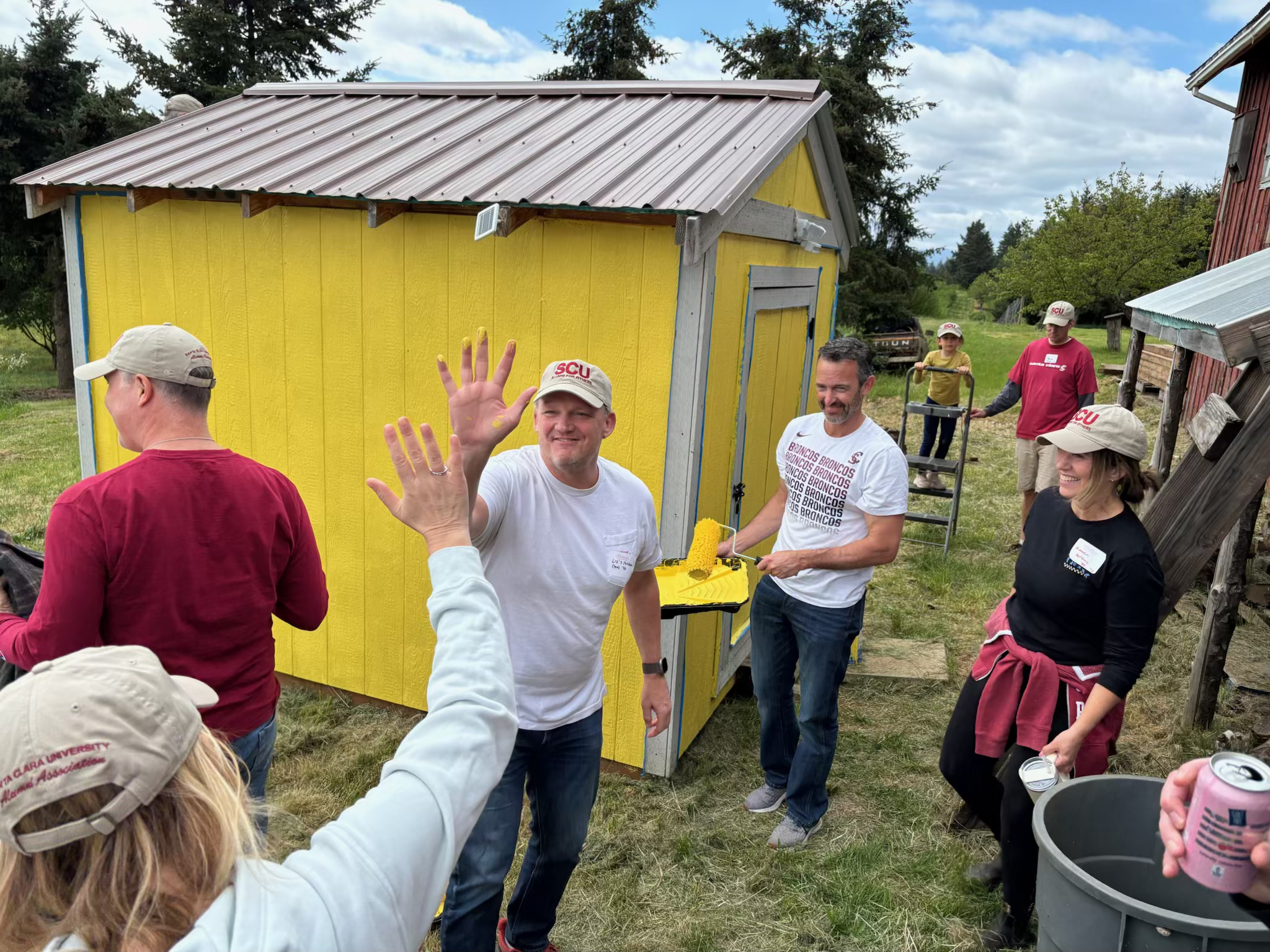 Alumni high fiving each other