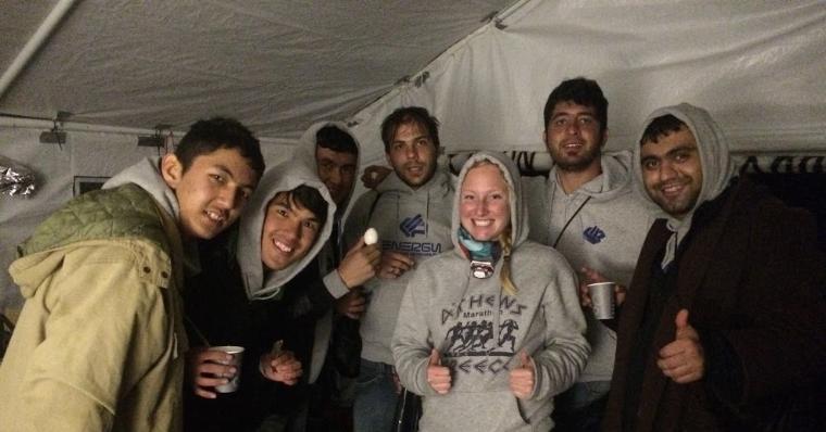 A group of six people posing for a photo indoors.