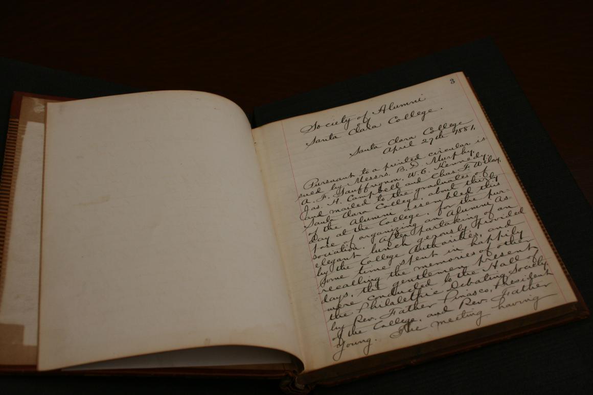 An open book displaying handwritten text.