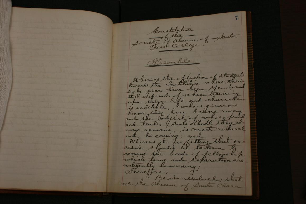 Handwritten text on an open book with the title 