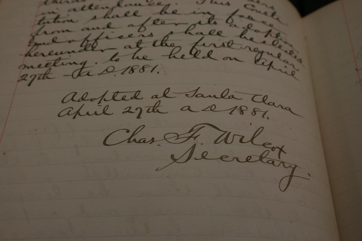 Handwritten text and signatures on a historical document titled 