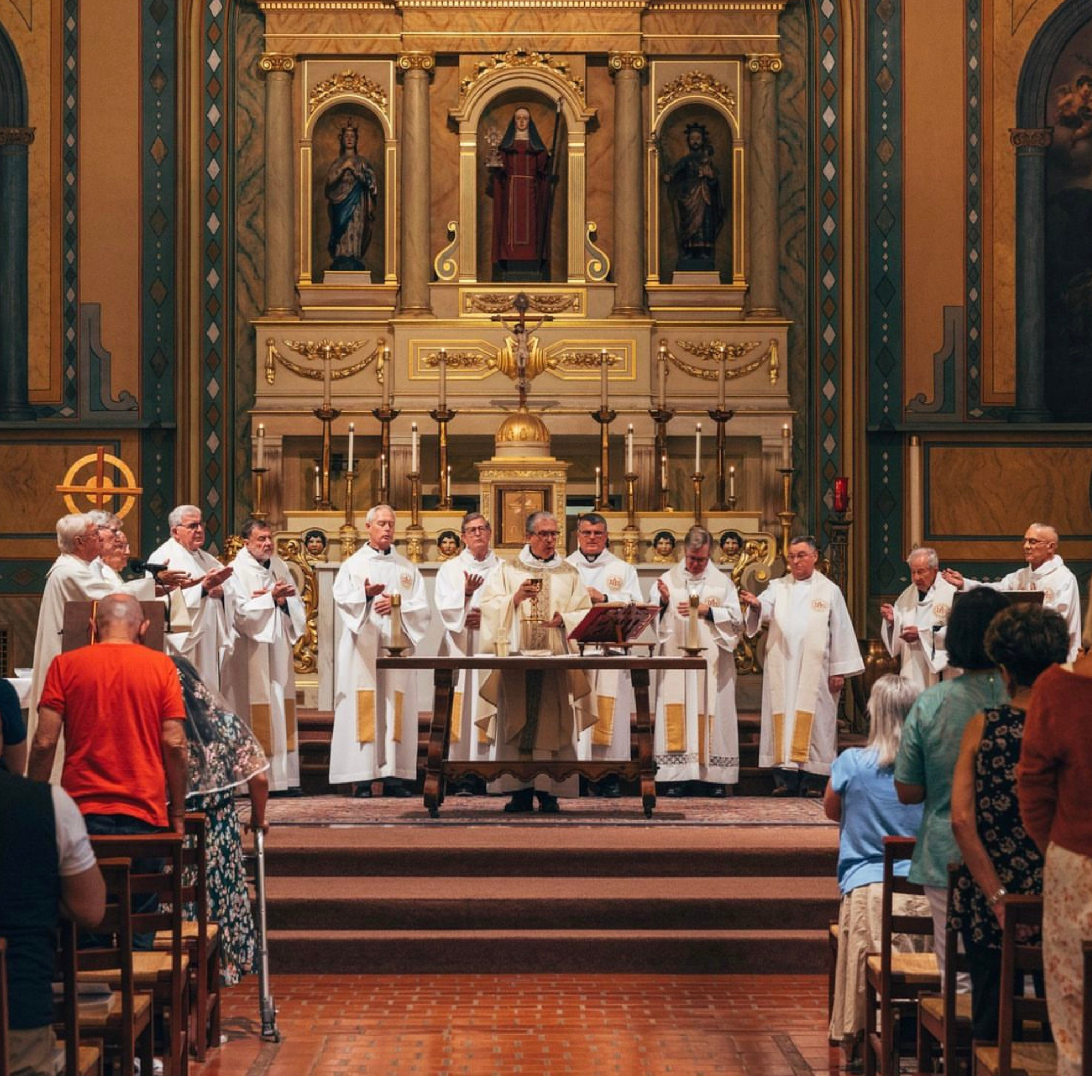 Priests gathered around altar 