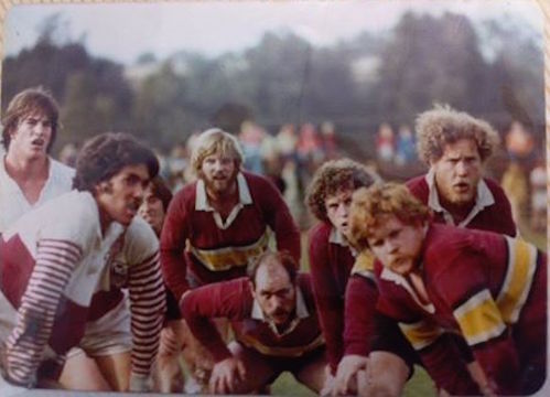 A group of rugby players preparing for a scrum. 
