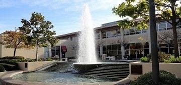 Benson Memorial Center exterior with a fountain in the courtyard.