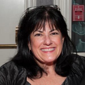 A woman smiling, titled 'Vaudagna, Annie.'