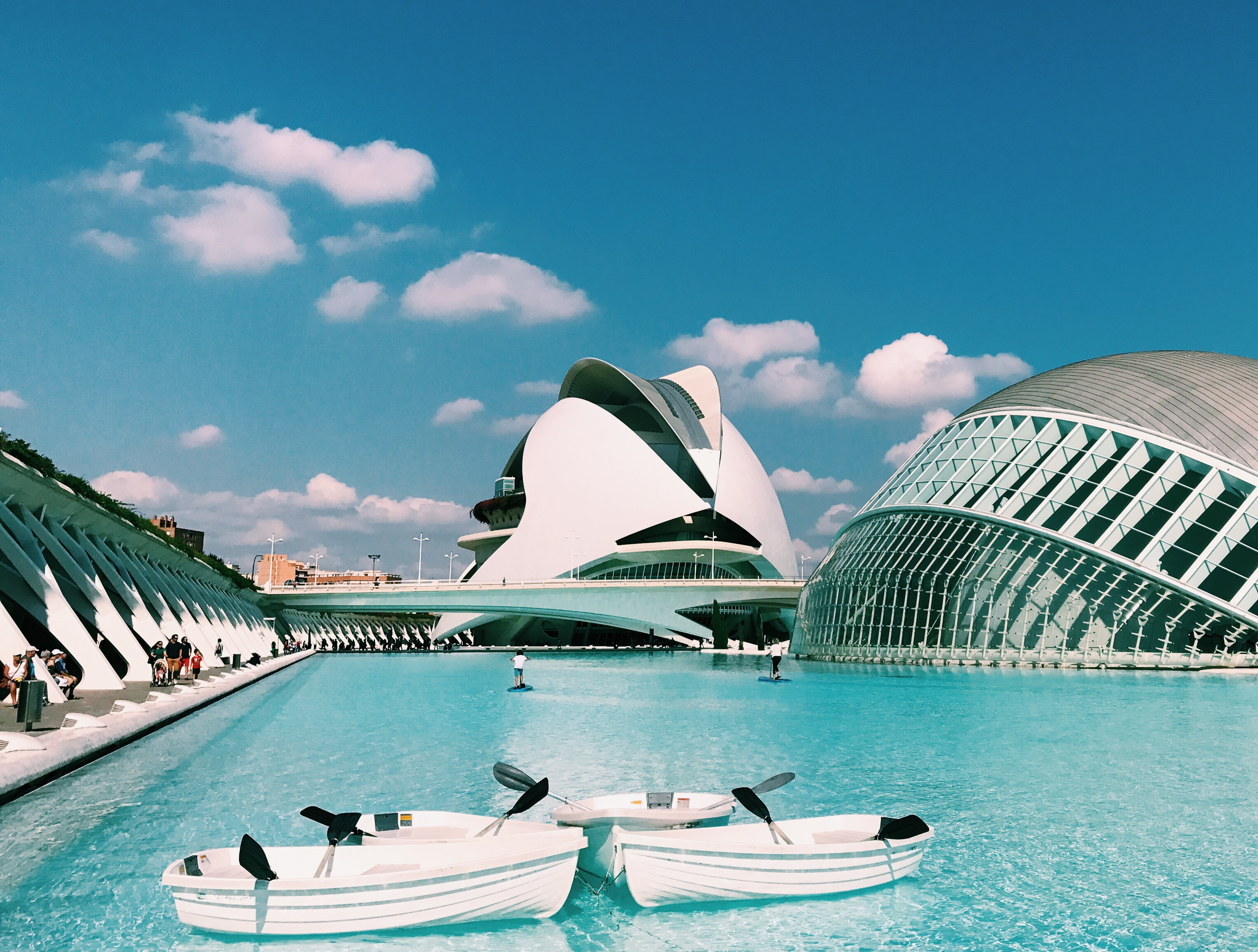 Decorative image of white building on blue water 