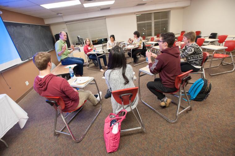 A small group of students in a classroom setting.