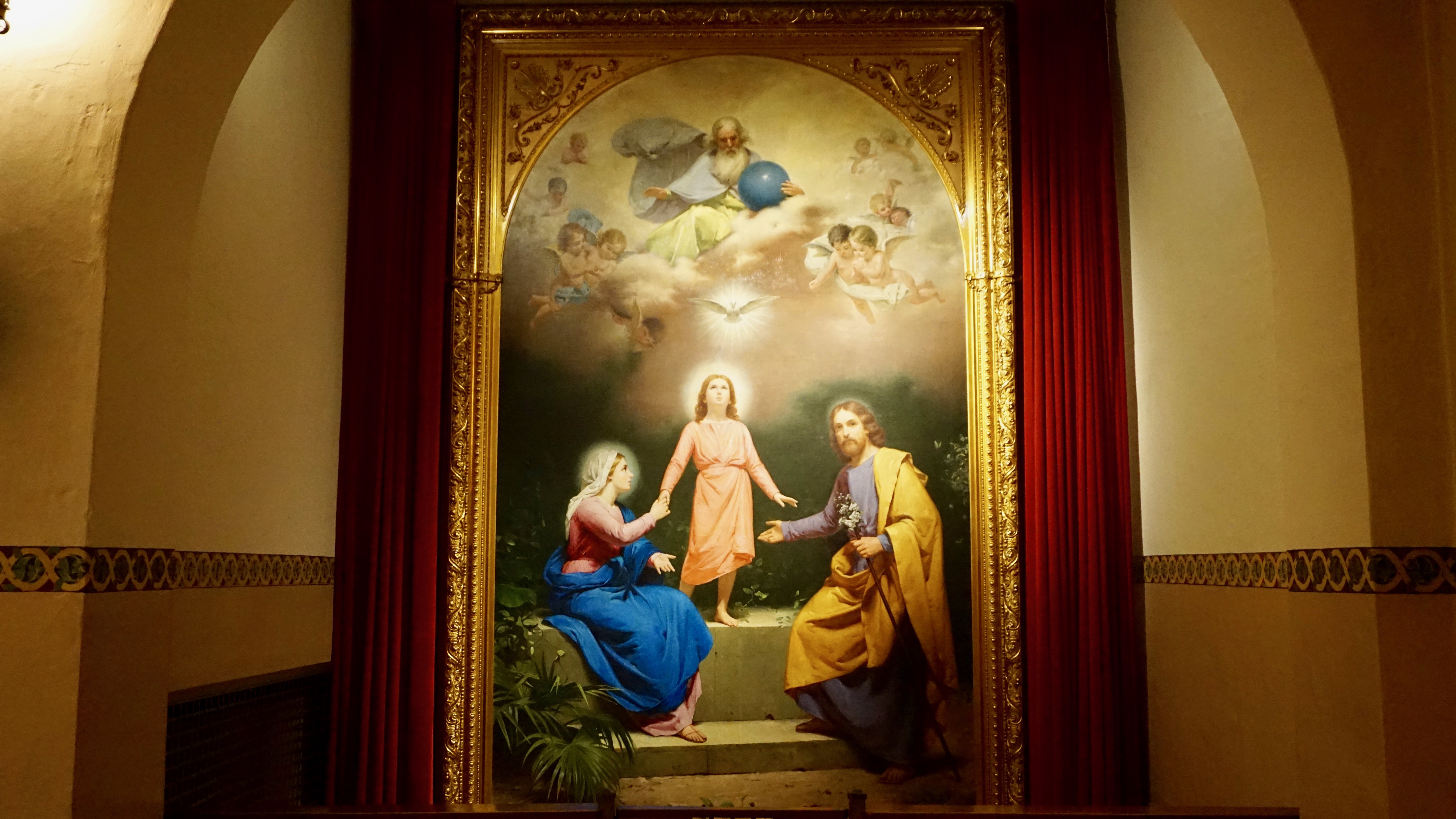Painting of the Holy Family in an ornate side chapel.