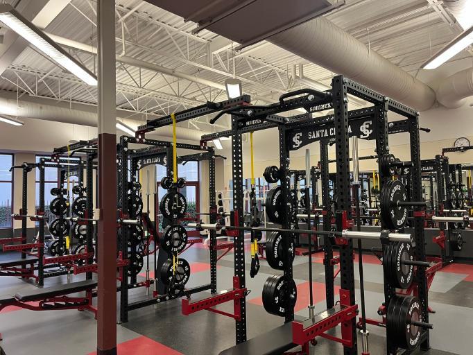 image of the weight room squat racks