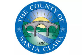 Circle with a bridge and sun behind it