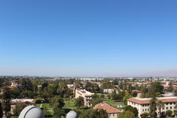 An overhead view of Santa Clara University's campus with the city of Santa Clara in the distance. image link to story