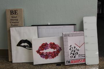 A collection of wall art and whiteboards