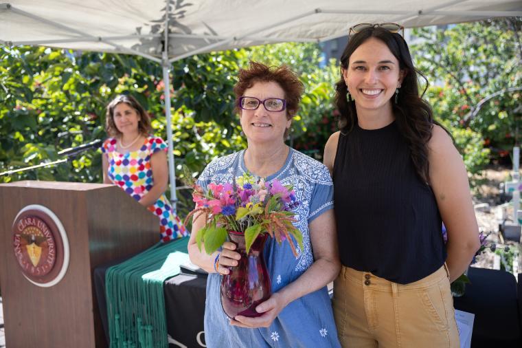 2025 Sustainability Celebration: A faculty member poses with a presenter after receiving a thank you gift