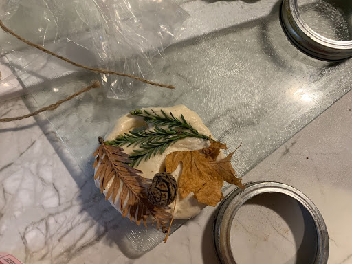 A meal with herbs and sauce on a countertop.