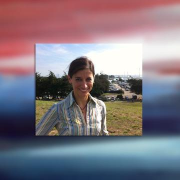 Profile photo of Kristin Kusanovich with a background of red and blue abstract paint strokes