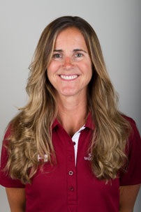 A smiling person wearing a red polo shirt. image link to story