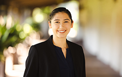 A young woman standing outdoors image link to story