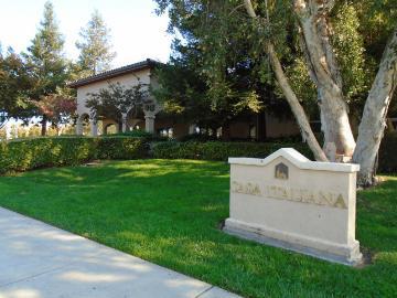 Casa Italiana building with lawn and sign in foreground.