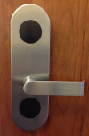 Alt text: Silver door handle labeled 