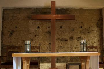 Wooden altar with items in St. Francis Chapel.