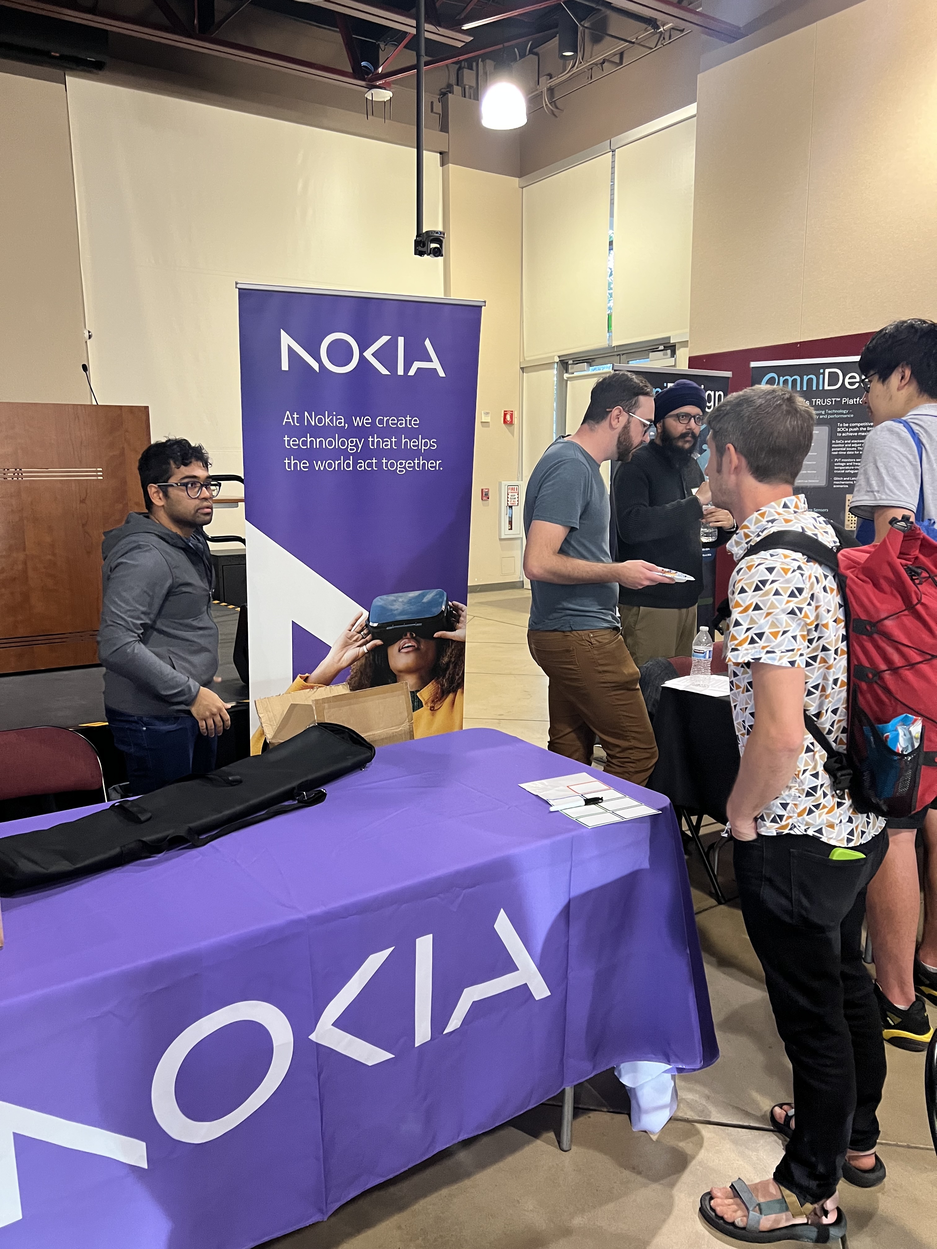 Faculty member Kurt Schab speaks with representatives from Nokia.
