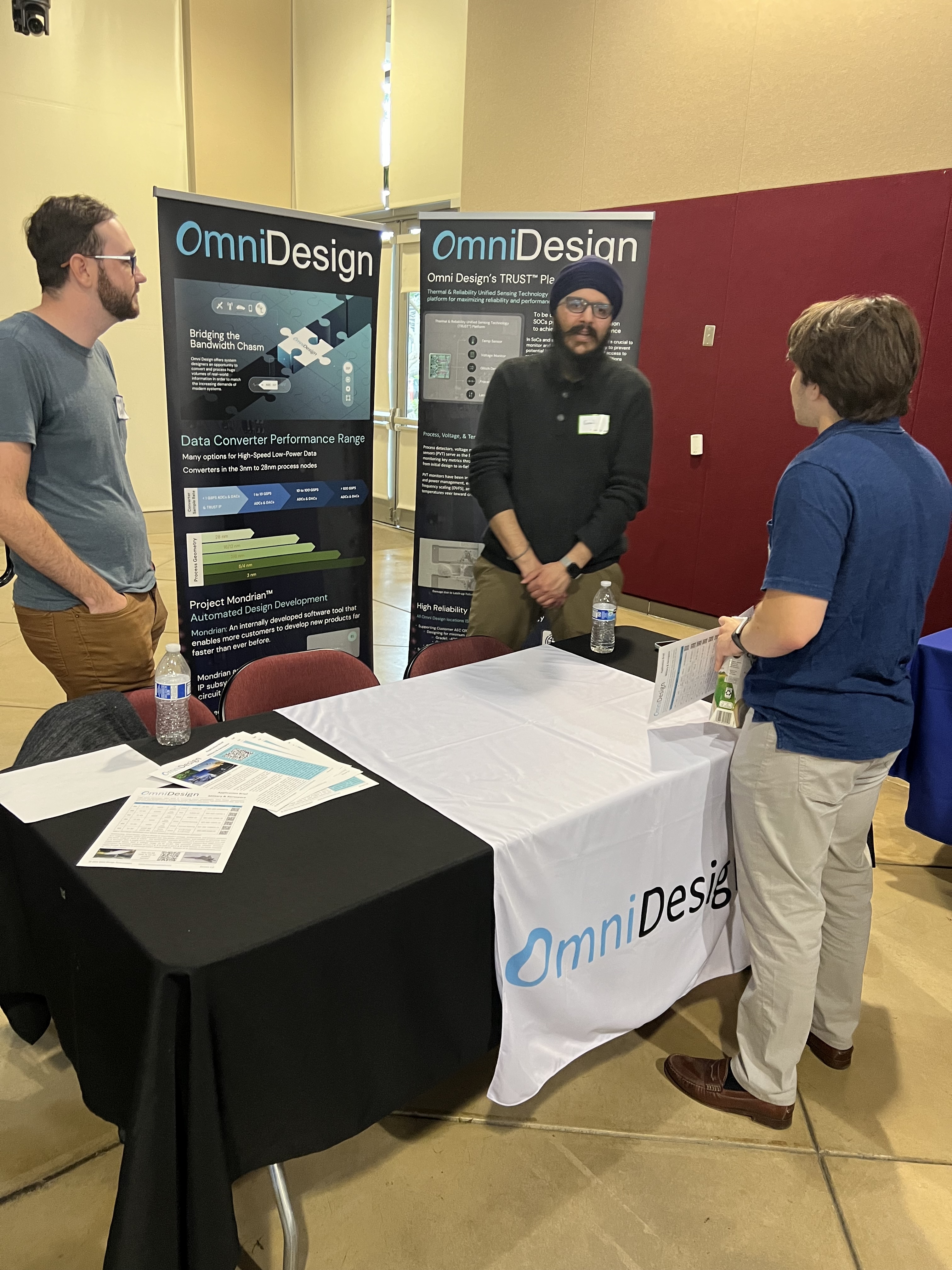 A student speaks with representatives from OmniDesign.