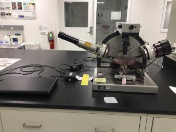 Alt text: Gaertner Ellipsometer on laboratory bench with various laboratory equipment.