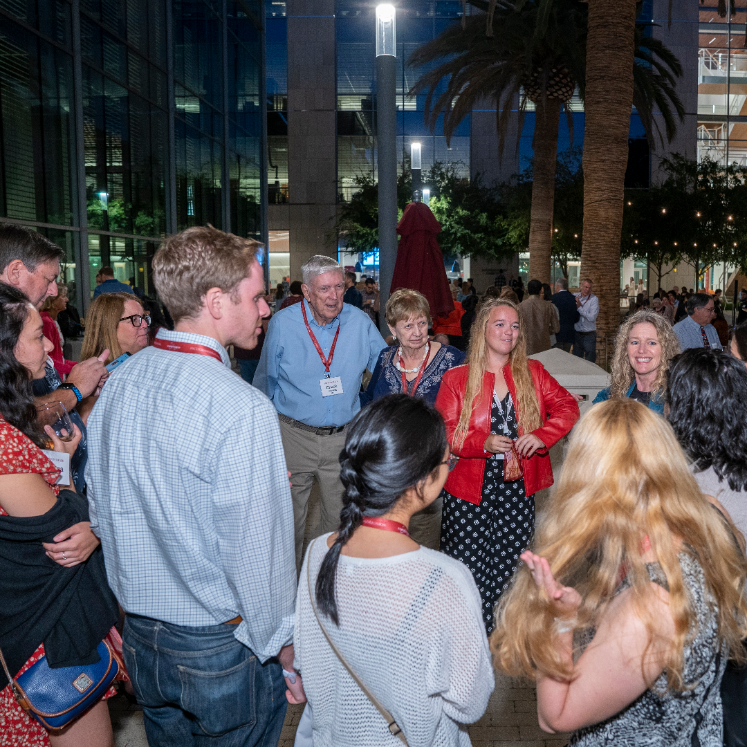People socializing at an evening event named "Grand Bash 2022".