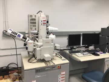 Alt text: Oxford EDS attached to a scanning electron microscope in a laboratory setting.