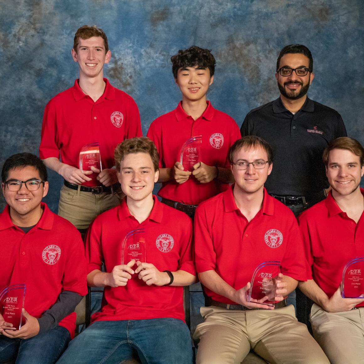 Five students and one faculty advisor pose with their project management awards
