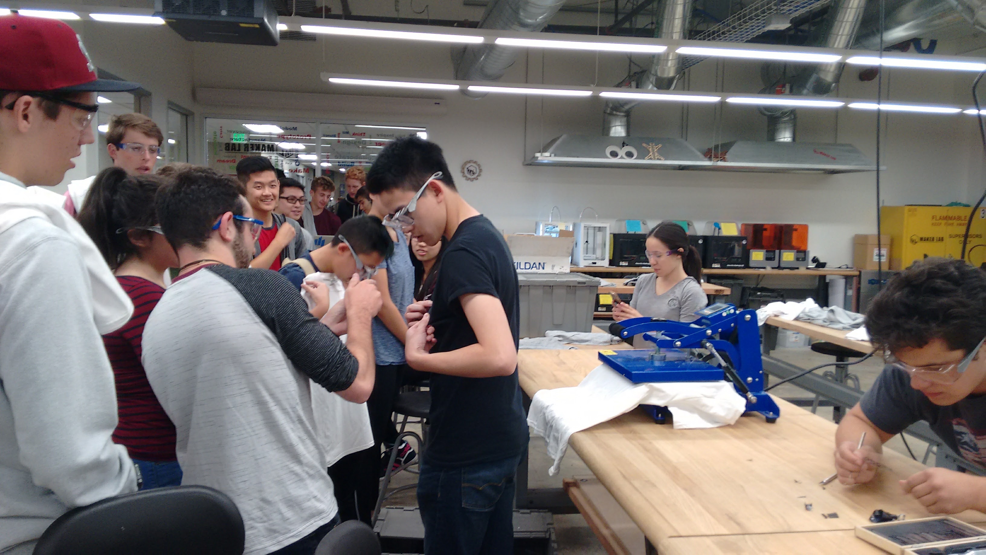 Students making t-shirts at Maker Club meeting
