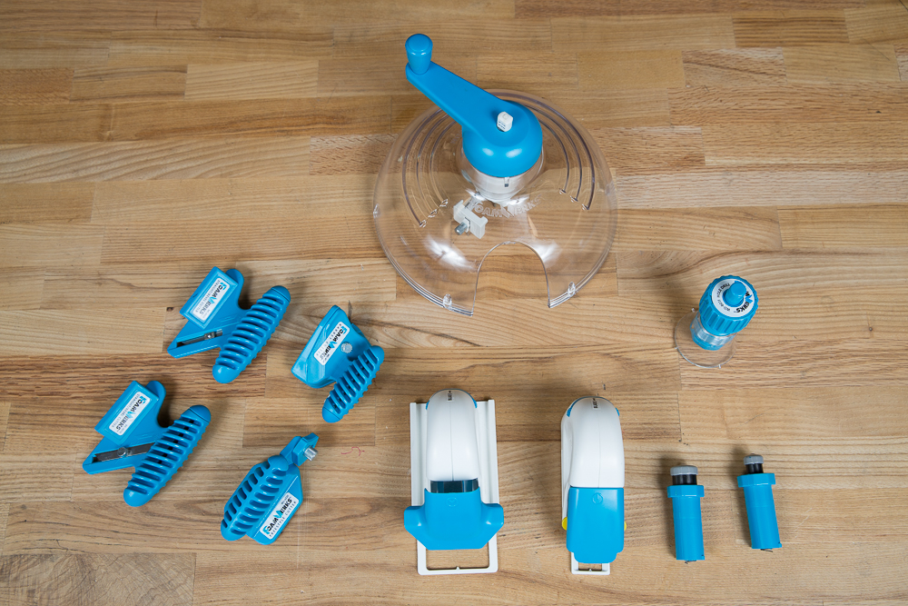 Various foamboard tools arranged on a wooden surface.