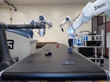 Robotic manipulator workcell with industrial robotic arms